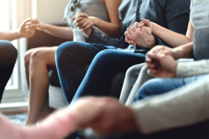 support circle holding hands